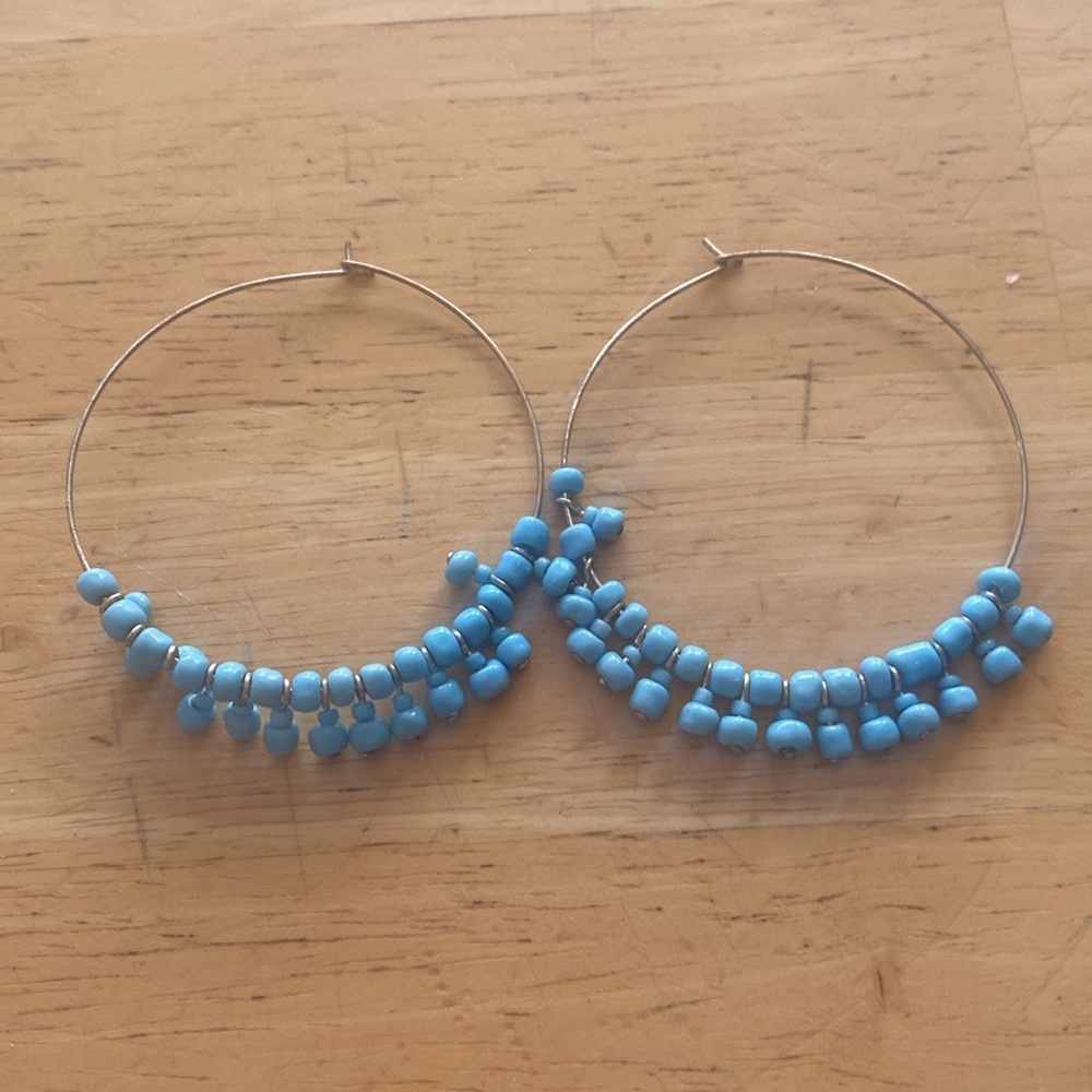 Turquoise colored beaded hoop earrings. Very lightweight